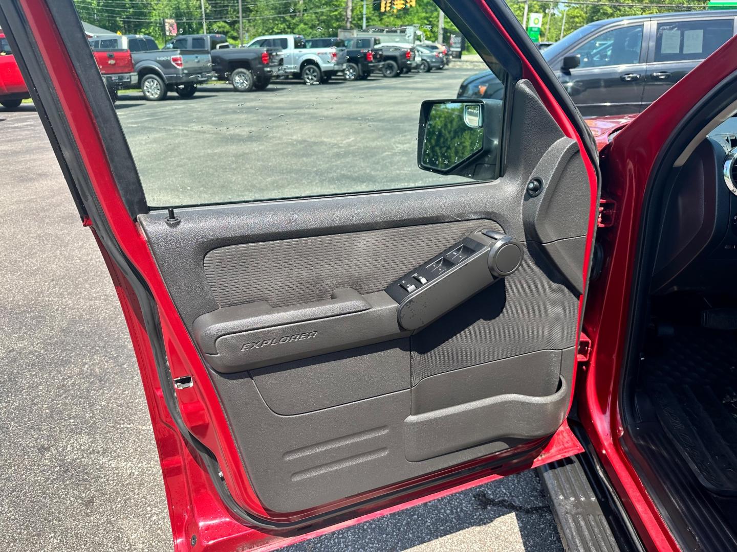 2009 Red /black Ford Explorer XLT (1FMEU73E89U) with an 4.0L V6 engine, 5-Speed Automatic transmission, located at 11115 Chardon Rd. , Chardon, OH, 44024, (440) 214-9705, 41.580246, -81.241943 - This 2009 Ford Explorer is a reliable and capable SUV, offering a 4.0L V6 engine paired with a 5-speed automatic transmission and full-time 4WD system. With a 3,500-pound towing capacity, it's suitable for moderate hauling needs. Additionally, the power driver's seat provides comfort and convenience - Photo#13